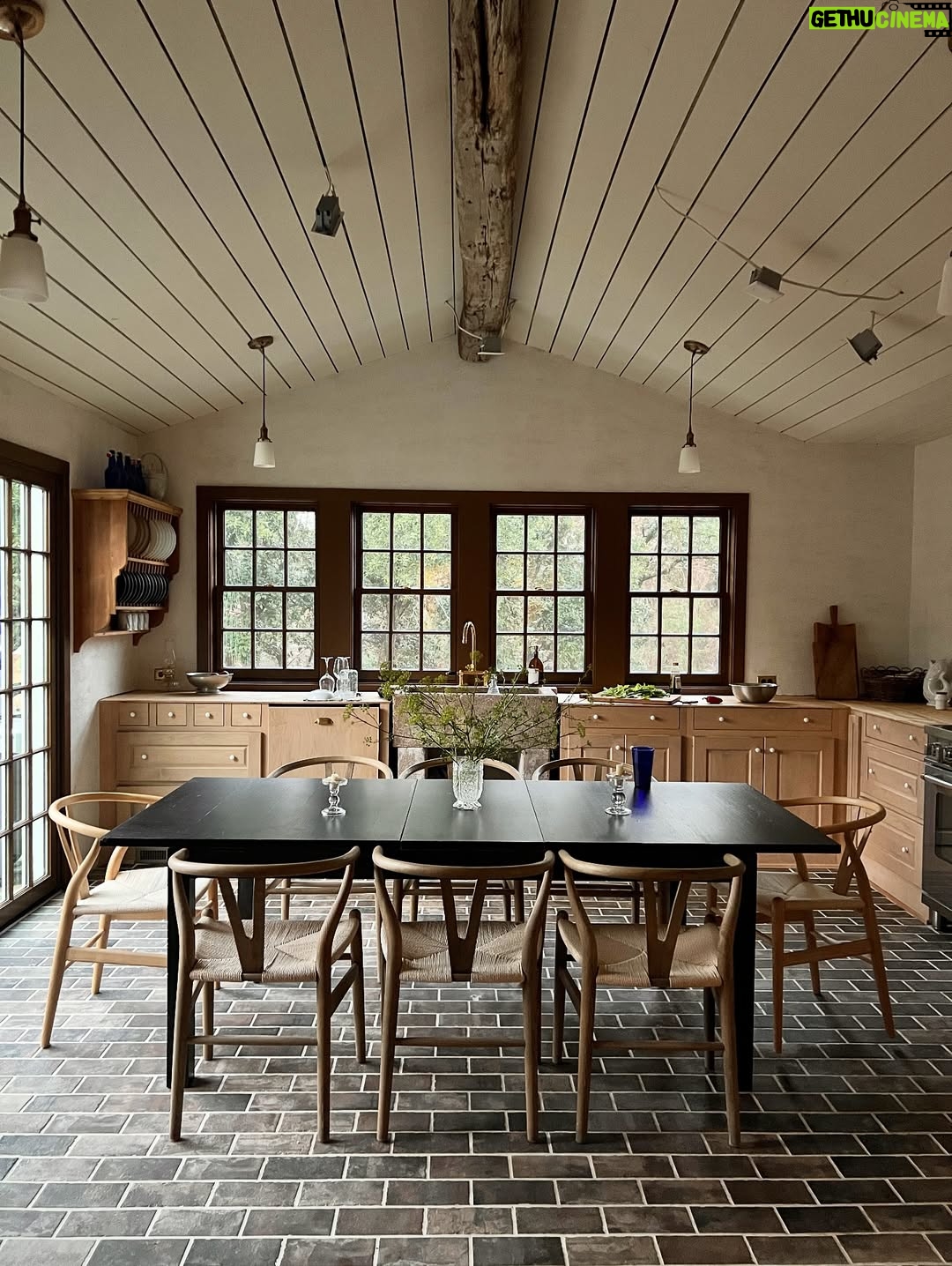 Lauren Liess - 2.3K Likes - The “Whalerman’s Watch” beach cottage is almost finished just in time for the holidays! 🐳 So thankful for this chill time with the family. Sending love to you and yours this Thanksgiving! 

The design details: 
Leftover beams from the Meadow give the place those old scrap wood Outer Banks vibes with a little bit o’ those old English Lost Colony Roots. The original houses around here were made from leftover scrap wood from barns, shipwrecks etc. Still working on things like installing countertops and lighting.

Stucco walls, planked board ceilings, painted old floorboards mixed with brick and some existing furnishings (the ikea table came with the house & we had most everything in our barn!) and a couple of new pieces (the Meadow sofa from my collection with @taylorkingfurniture   an antique Swedish 1872-painted chest) have made this place into a relaxed, cozy, and flop-able beach pad. Loving it in the off-season with candles, kids and pups.  The whole renovation is featured in our “Saving Lost Cottages of the Outer Banks” video series. 🤍🌊