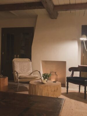 Lauren Liess Instagram - The “Whalerman’s Watch” beach cottage is almost finished just in time for the holidays! 🐳 So thankful for this chill time with the family. Sending love to you and yours this Thanksgiving! 

The design details: 
Leftover beams from the Meadow give the place those old scrap wood Outer Banks vibes with a little bit o’ those old English Lost Colony Roots. The original houses around here were made from leftover scrap wood from barns, shipwrecks etc. Still working on things like installing countertops and lighting.

Stucco walls, planked board ceilings, painted old floorboards mixed with brick and some existing furnishings (the ikea table came with the house & we had most everything in our barn!) and a couple of new pieces (the Meadow sofa from my collection with @taylorkingfurniture   an antique Swedish 1872-painted chest) have made this place into a relaxed, cozy, and flop-able beach pad. Loving it in the off-season with candles, kids and pups.  The whole renovation is featured in our “Saving Lost Cottages of the Outer Banks” video series. 🤍🌊