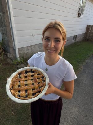 Sophie Nélisse Instagram - Just a girl overly excited about her homemade blueberry pie and her new dragonfly friend