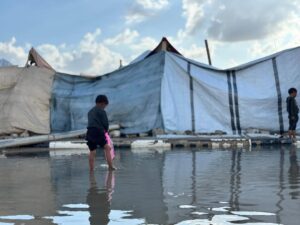 Yasmine Al Massri Instagram - Rain that soaks to the bone, with nowhere to get dry. 

The rain in Gaza is flooding tents, soaking shelters and destroying the only belongings that Palestinian people have. 

It is more than devastating. Palestinians have been surviving through a genocide, through continuous bombardment, homes and community crumbling into rubble, famine and starvation, a complete destruction of health infrastructure. And now, the rain is destroying and dampening any refuge or shelter that existed. 

Our partners are doing everything they can, but in the face of such destruction, it is harder than ever to create conditions that can keep people safe or give them the chance to heal. 

At least 347 people, including 136 children, have been killed in Israeli attacks since the ceasefire was declared, while Israel has continued to block aid and desperately needed medical supplies. 

We call on the international community to act, and to hold Israel’s Government accountable for war crimes. 

Please share. Please donate to support our partners work via the link in our bio. 

End the genocide. 

Images from our partner @aneraorg