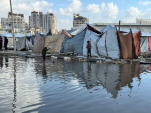 Yasmine Al Massri Instagram - Rain that soaks to the bone, with nowhere to get dry. 

The rain in Gaza is flooding tents, soaking shelters and destroying the only belongings that Palestinian people have. 

It is more than devastating. Palestinians have been surviving through a genocide, through continuous bombardment, homes and community crumbling into rubble, famine and starvation, a complete destruction of health infrastructure. And now, the rain is destroying and dampening any refuge or shelter that existed. 

Our partners are doing everything they can, but in the face of such destruction, it is harder than ever to create conditions that can keep people safe or give them the chance to heal. 

At least 347 people, including 136 children, have been killed in Israeli attacks since the ceasefire was declared, while Israel has continued to block aid and desperately needed medical supplies. 

We call on the international community to act, and to hold Israel’s Government accountable for war crimes. 

Please share. Please donate to support our partners work via the link in our bio. 

End the genocide. 

Images from our partner @aneraorg