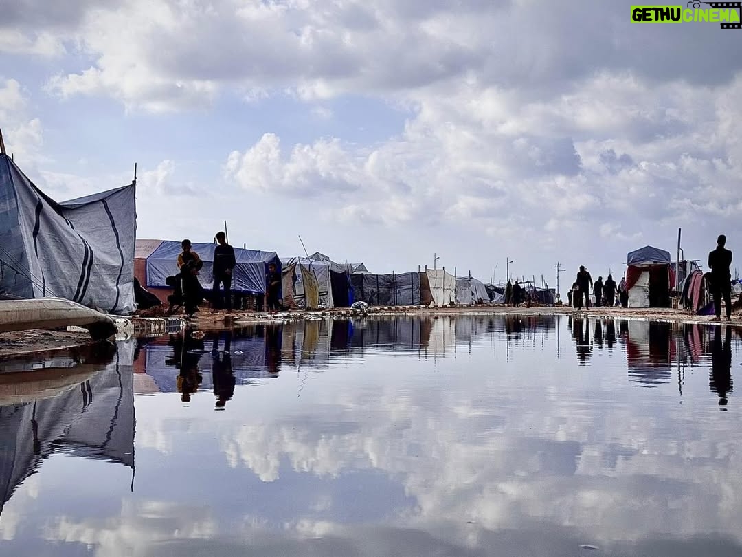 Yasmine Al Massri - 513 Likes - Rain that soaks to the bone, with nowhere to get dry. 

The rain in Gaza is flooding tents, soaking shelters and destroying the only belongings that Palestinian people have. 

It is more than devastating. Palestinians have been surviving through a genocide, through continuous bombardment, homes and community crumbling into rubble, famine and starvation, a complete destruction of health infrastructure. And now, the rain is destroying and dampening any refuge or shelter that existed. 

Our partners are doing everything they can, but in the face of such destruction, it is harder than ever to create conditions that can keep people safe or give them the chance to heal. 

At least 347 people, including 136 children, have been killed in Israeli attacks since the ceasefire was declared, while Israel has continued to block aid and desperately needed medical supplies. 

We call on the international community to act, and to hold Israel’s Government accountable for war crimes. 

Please share. Please donate to support our partners work via the link in our bio. 

End the genocide. 

Images from our partner @aneraorg