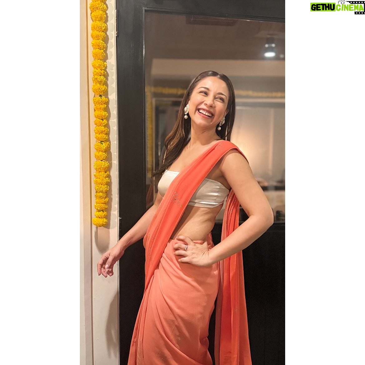 Amrita Puri - 2.5K Likes - 🧡 🪔  @vaibhav.rekhi and @diamirzaofficial are all the love and light we need. Bringing together the best.

*Repeated my crop top with a different sari story. 
Clearly I have a thing for bright colours and marigolds. 

(Thanks for those solo stills @sayanigupta).