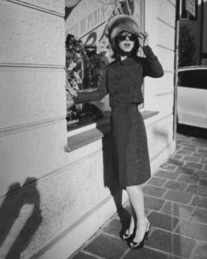 Anjelica Bette Fellini Instagram - Local Italian craftsmanship, done right 

hand sown 1960s Gina Mianchini Moiré silk set paired with a hat from Bolzano’s atelier Biasion

Anjelica for Pezzi di Perla, 📷 by @evavgelder 
special thanks to @staeaeaef