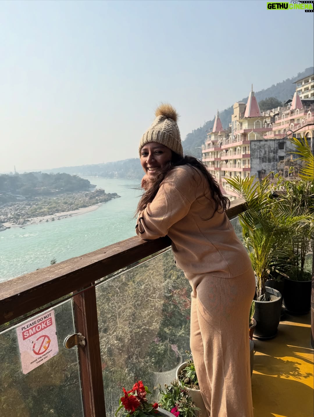 Anumol - 18.4K Likes - A day at Rishikesh 🤍
I didn’t explore much. I came here with no plans just decided to surrender to the place and flow with it. Got to know the city a little, experienced the Ganga, and honestly, that felt enough.
Also, had to mention @bemonkwellness food was amazing, so tasty, and felt like proper healthy food so delicious and looked nice also. So comforting. Loved the ambience, the yoga space, and especially that balcony at the restaurant area🤍 
This day is only about roaming around Lakshman Jula, Ganga Arti and food.. Back home play time with Kanmani, Leela & Yoda. Some places don’t need rushing. They just need feeling 🧿