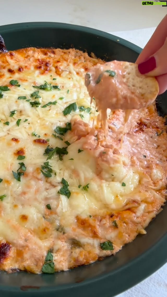 Dina Deleasa - 616 Likes - Crab Fra Diavolo Dip is what you need for Christmas Eve and beyond. If you are Italian American you may be planning your Seven Fishes menu. Maybe you are like my family where you have one too many favorites. This is a great way to serve an old favorite in a new way! Keep in mind if you like things on the spicier side adjust the red pepper and hot sauce according to your tolerance!

Buon Natale! Recipe below, share it like it, love it! Can’t wait to share more recipes and traditions over the next couple of days. Make sure to follow along with @dishitgirldina. And if you need a great recipe for Zuppa Di Clams, head over to dishitgirl.com!

1 tbsp olive oil
3 large garlic cloves, finely chopped
3 tbsp finely chopped yellow onion
1 tsp red pepper flakes
1 cup crab claw meat
3 tbsp white wine
1 tbsp lemon juice
1 tbsp unsalted butter
1/2 cup crushed tomatoes
1 tsp kosher salt
1/2 tsp black pepper
 8oz cream cheese
1/4 cup mascarpone cheese
1/4 cup mayo
2 tsp hot sauce
I cup shredded mozzarella cheese, divided
1/4 cup shredded parmesan cheese
fresh parsley for garnish

Preheat the oven to 350 degrees.
Heat olive oil in a large saute pan over medium heat, add the garlic and onion, saute for 3 minutes until onions become translucent. Then add the crab, breaking it up with a wooden spoon as you saute another 2 minutes, Then pour in the wine and lemon juice,  let it simmer for another 4 minutes, then add the crushed tomatoes, season with salt and pepper, stir to incorporate. Let it saute gently for another 3 minutes, turn off the heat.

In a large bowl add the cream cheese, mascarpone, mayo, and hot sauce. Using an electric mixer on a medium speed mix together until uniform and smooth. Fold in 1/2 cup of the mozzarella cheese. Then add the crab mixture and fold in gently until well combined. Pour the mixture into a 9 inch pie dish. Top with the rest of the mozzarella cheese, along with the parmesan. Place in the preheated oven for about 20 minutes until the top becomes bubbly and brown.