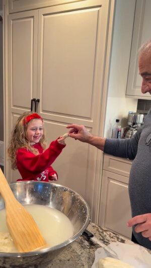 Dina Deleasa Instagram - My dad has been making fresh mozz since I was little ! I know it’s super trendy now but to me it’s a special tradition.

It’s simply curd and super hot water and some salt ! It’s warm and chewy, the most delicious thing ever ! What’s even better is mine my daughter stands by his side waiting for the first piece like I used to!

Merry Christmas Eve !!!