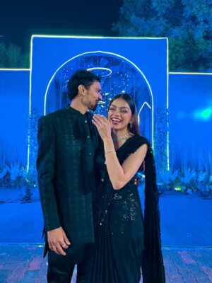 Dixita Patel Instagram - First wedding as fiancés and suddenly everything feels extra special 🥹💍🫶
.
.
.
First saree look - @houseofbaisa_jaipur 
Black saree - I made it from scratch 
Red set - @deepak_tailor_gk 
Pastel Pink anarkali - @labelratan
.
.
#wedding #couple #indianwedding #shaadi #couples