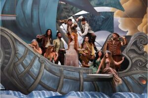 Eliotte Woodford Instagram - Making #TheFateofOphelia MV was not only a nostalgic family reunion but also an exciting celebration of the masterful musical future @taylorswift was creating in real time right before our eyes. 🤩
My heart was overflowing with JOY just getting to be back with my friends that are family and on top of that, we got to put on the COOLEST SKIT EVER! 😂 🎭🎬
My musical theater loving soul couldn’t handle the scale and beauty of each set, wig, costume, and choreography. I was overcome with emotion and gratitude more than once during this shoot. The large scale MGM movie musicals and dream ballets I had always dreamt of being a part of were happening and I now got to be included. 🥹😭🥹
Bravo to the incredible crew that made this happen and to @nopenother and @amandabalen for ALWAYS creating and leading with such grace and genius. 👏🏾👏🏾👏🏾
I just can’t believe I get to be a part of the magical worlds @taylorswift consistently creates. Thank you for including me, and all of us, on this ride, T!
Also- I can’t believe we were in MOVIE THEATERS AGAIN! 🤯
I will always be proud to live #TheLifeofaShowgirl
😘❤️🔥💃🏽