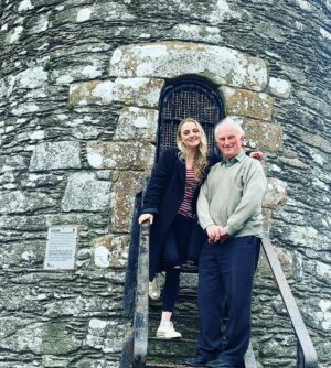 Evanna Lynch Instagram - Little Irish history tour with my Dad for @tourismireland 🌳🪨 My dad was a history teacher for over 30 years (I’m sure these pics will give his past pupils flashbacks…) so I thought it would be interesting to ask him what lesser known location he’d like to share with anyone interested in local Irish history. And his eyes lit up and he insisted we go visit the monastery in Monasterboice and this old cross! Which is actually very impressive when you realise how bloody ancient it is. Here are some facts from my dad:

🌳The cross in the pictures is St Muireadach’s Cross and is one of the finest surviving examples of early medieval Irish sculpture.

🪨 It’s situated amid the ruins of the ancient Irish monastery of Monasterboice in Co.Louth.

🌲Muireadach’s Cross is from the 10th century and is thought to have been called after Muireadach Mac Domhnall, one of the monastery’s most famous abbots who died in 923AD.
 
🗿The carvings on the cross depict scenes from the bible and may have been used by the monks to tell the story of creation and salvation to visitors to the monastery.

☘️Ancient Irish monasteries we’re often circular and had two distinctive features: a round tower and one or more high crosses, both of which you can see in these pics. 

Check out my stories to see my dad explaining some of the scenes on the cross. His passion is very infectious ☺️ Thanks @tourismireland for encouraging me to rediscover some of the history of Co.Louth, we do have some cool things going on in the wee county.

#WelcomingSoon #Ad #Ireland #TourismIreland