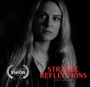 Jackie Moore Instagram - STRANGE REFLECTIONS is an Official Selection at Vision 2025 - and is trending on #ShortVerse.
This little holiday horror short came from an idea I had three weeks ago - made with no budget, written, shot, edited, and scored by me.
Proof that you don’t need permission. You just make it yourself. 🖤