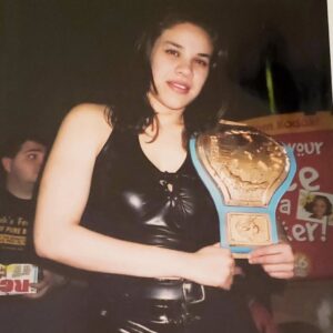 Jamine Benitez Instagram - NOV 12, 2000

🖤 25 Years in the Ring 🖤

HAPPY 25TH WRESTLE-VERSARY.

Not too bad, babygirl.

From a shy 19-year-old girl in Waterbury, CT..
Who would’ve thought the universe had this path in store?

It wasn’t easy breaking down barriers.
It wasn’t easy not fitting into the mold of a “female wrestler.”
It wasn’t easy forging my own path.
But that path helped build the foundation for women’s wrestling today.

As I look back over 25 years in this business,
I can say with my whole heart—
I gave you everything I had.

I sacrificed more than I should’ve…
But those sacrifices made me who I am.

Now, as I step into my 25th year,
There’s nothing left to prove.
Nothing left to give.
Nothing left to sacrifice.

I’m content.
I’m satisfied.
I’ve done more than I ever dreamed possible.

This will be my final year of active, in-ring wrestling.

The bookings will slow down.
The travel will fade.
The “rassle” will quiet…

But the memories? They’ll live forever.
The family born from this business.
The lifelong friends who held me down through it all.

The Silver Anniversary Tour begins...
And it will end soon.

To my 19-year-old self:
I’m proud of you.
You persevered.
You survived.
You helped change women’s wrestling.

Most of all—you found your voice, and you used it to say what others were afraid to say.

No regrets.
No remorse.

Thank you! 
to my family,
to my friends,
to my fellow wrestlers,
to every company that ever believed in me,
and to my fans around the world.

Thank you for 25 years.
This chapter is closing… but the story lives forever.