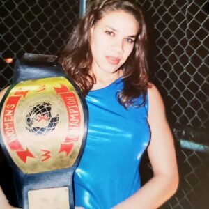 Jamine Benitez Instagram - NOV 12, 2000

🖤 25 Years in the Ring 🖤

HAPPY 25TH WRESTLE-VERSARY.

Not too bad, babygirl.

From a shy 19-year-old girl in Waterbury, CT..
Who would’ve thought the universe had this path in store?

It wasn’t easy breaking down barriers.
It wasn’t easy not fitting into the mold of a “female wrestler.”
It wasn’t easy forging my own path.
But that path helped build the foundation for women’s wrestling today.

As I look back over 25 years in this business,
I can say with my whole heart—
I gave you everything I had.

I sacrificed more than I should’ve…
But those sacrifices made me who I am.

Now, as I step into my 25th year,
There’s nothing left to prove.
Nothing left to give.
Nothing left to sacrifice.

I’m content.
I’m satisfied.
I’ve done more than I ever dreamed possible.

This will be my final year of active, in-ring wrestling.

The bookings will slow down.
The travel will fade.
The “rassle” will quiet…

But the memories? They’ll live forever.
The family born from this business.
The lifelong friends who held me down through it all.

The Silver Anniversary Tour begins...
And it will end soon.

To my 19-year-old self:
I’m proud of you.
You persevered.
You survived.
You helped change women’s wrestling.

Most of all—you found your voice, and you used it to say what others were afraid to say.

No regrets.
No remorse.

Thank you! 
to my family,
to my friends,
to my fellow wrestlers,
to every company that ever believed in me,
and to my fans around the world.

Thank you for 25 years.
This chapter is closing… but the story lives forever.