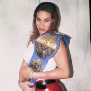 Jamine Benitez Instagram - NOV 12, 2000

🖤 25 Years in the Ring 🖤

HAPPY 25TH WRESTLE-VERSARY.

Not too bad, babygirl.

From a shy 19-year-old girl in Waterbury, CT..
Who would’ve thought the universe had this path in store?

It wasn’t easy breaking down barriers.
It wasn’t easy not fitting into the mold of a “female wrestler.”
It wasn’t easy forging my own path.
But that path helped build the foundation for women’s wrestling today.

As I look back over 25 years in this business,
I can say with my whole heart—
I gave you everything I had.

I sacrificed more than I should’ve…
But those sacrifices made me who I am.

Now, as I step into my 25th year,
There’s nothing left to prove.
Nothing left to give.
Nothing left to sacrifice.

I’m content.
I’m satisfied.
I’ve done more than I ever dreamed possible.

This will be my final year of active, in-ring wrestling.

The bookings will slow down.
The travel will fade.
The “rassle” will quiet…

But the memories? They’ll live forever.
The family born from this business.
The lifelong friends who held me down through it all.

The Silver Anniversary Tour begins...
And it will end soon.

To my 19-year-old self:
I’m proud of you.
You persevered.
You survived.
You helped change women’s wrestling.

Most of all—you found your voice, and you used it to say what others were afraid to say.

No regrets.
No remorse.

Thank you! 
to my family,
to my friends,
to my fellow wrestlers,
to every company that ever believed in me,
and to my fans around the world.

Thank you for 25 years.
This chapter is closing… but the story lives forever.