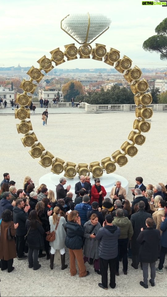 Joana Vasconcelos - 1.4K Likes - Unveiling Solitário, the second public artwork by Joana Vasconcelos in Rome.

Set on the iconic Pincio Terrace, this monumental “diamond ring” made of 110 golden circles and 1,450 crystal glasses transforms the city skyline — a spectacular prelude to the upcoming VENUS exhibition opening in January 2026.

With the Patronage of Roma Capitale and in collaboration with the Assessorato alla Cultura and Municipio I Roma, Solitário continues a unique artistic journey through the city, celebrating creativity, culture, and community.

Just the beginning of what VENUS will reveal.

#pm23
#valentinolegacy 
#beautycreatesbeauty
