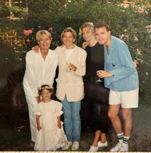 Joely Richardson Instagram - Thinking about families over these holidays. How much we can infuriate each other, push each others buttons etc, but oh that  primordial LOVE. These photos were taken the summer my sister Natasha got married. After her honeymoon she came to visit us in London . My daughter @daisybevan had been her bridesmaid so rushed to put her outfit back on. My brother Carlo was there . Mum hadn’t been able to go to the wedding so we raised a glass . Raising a glass to you and yours on this eve of a new year x #90s #2026