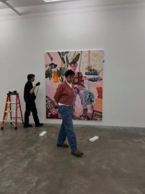 Jordan Casteel Instagram - Honestly, it’s hard to believe “Covering the holes in our walls with sunflowers” is opening this Wednesday, November 5th at @caseykaplangallery 
… this self portrait was imagined over a year ago… the original iteration in my head was going to be a portrait of me holding the child we’ve been journeying towards for nearly 5 years. A finale of the musings and deep manifestations we’ve been longing for. 

As life does, it didn’t happen the way I hoped, we had more to grieve and thus the grappling of whether or not to still make the portrait loomed large… The holes in the walls seemingly grew and multiplied… but the reality is I’ve always said “I have not yet had the privilege of being a mother, but the process of painting, loving, nurturing, pruning, pouring into and letting go is something I imagine it would be like.” From a seed a sunflower will grow… 

The day I finished this portrait we heard a heartbeat for the first time. It took:
1 lupus diagnosis at 18
1 doc who said it was never possible
Years on methotrexate
2 egg retrievals 
2 surrogates
2 agencies
6 transfers 
1 egg donor
5 years dreaming 
Our baby will bloom April 2026 — after complete surrender and a long winter. We have the best surrogate turned friend, we ended up with an egg donor, and we have grieving still to do as we continue to honor the potentials and the realities. Now that we are here, I see it all so clearly — nothing feels more fitting than our flower being grown in a community garden. 

This show holds it all for me. It’s only right that I quite literally stay in the room while you see it. That you see the seedlings and the blooms. That you see me.

•••

Title from Alice Walker, from In Search of Our Mothers’ Gardens

[Jordan, oil on canvas, 94 x 80 inches, 2025]