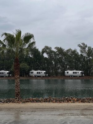 Kelly Noonan Instagram - Going to @surf.ranch last weekend was a bucket list moment. Despite the rain, we were all smiles. The staff at Surf Ranch were so sweet, talented and took such great care of us. The Airstreams were super cozy, the food was delicious, and the waves were, well, perfect (although intimidating too!)
I’m forever grateful for the legend @raimanaworld taking me under his wing and pushing me to be brave and trust myself. Listen to his genuine stoke as he cheers me on in the video. “Trust yourself” and “I love you!” he shouts at me. I went from a 10ft soft top to a 7’2” real board by the end of the weekend. He dropped me into the barrel and got me shampooed 🤣 I am proud of myself, because it does take courage to get out there on those CT3s! Thank you to @briannacope for always firing me up. “Are you PUMPED!?” I can’t wait to keep improving my form so I can keep up with Julianne 🔥
And to my beautiful friend @juleshough THANK YOU for inviting me to be a part of such a special weekend and such an extraordinary group of humans. Can’t wait to go back with you all when the sun is out! @kellyslater thank you for creating this little piece of heaven on Earth 🤙🏄♀️