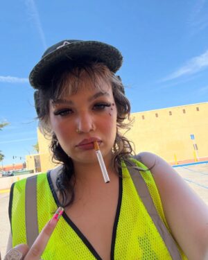 Lola Young Instagram - oh hi..
coachella i’ll see you tomorrow @ 4:50 - Mojave Tent
im soaking up the heat and feeling nervous af even tho in these photos i look the opposite - proof that social media is all a lie, still gonna shake my ass tho & pretend im fine lmaoooo.. see u there tomorrow🙃