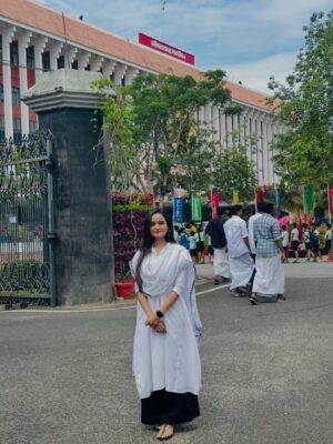 Meenakshi Anoop Instagram - What does a 20year old girl dream of ? This is beyond a dream❤️Walking through the Kerala Niyamasabha ✨with pride, confidence high, head held strong Being invited here didn’t just honour me it built me! A moment of power, growth, and fearless interaction Proud of the woman I am becoming🫶🏻 

.

.

.

.

.

.

.

.

.

.

Thank you @avaanahdesignerstudio for this dream outfit ✨