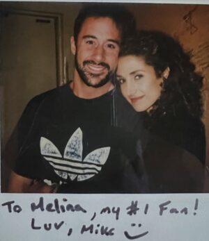 Melina Kanakaredes Instagram - Thomas Wolf said: “You can never go home again” but John Masius believed that with a little divine “PROVIDENCE” #SydHansen could!♥️ 26 years ago this show changed so many lives - especially mine!! I LOVED playing Syd Hansen! From the DREAMS and  COSTUMES to the amazing FAMILY we became in front of and especially behind the camera— Thank you John for creating #Providence♥️ And thank you to @scarletmasius for giving me that polaroid of us when we first met on the set!! I hope you all enjoy these photos as much as I did. ♥️ RIP John♥️