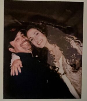 Melina Kanakaredes Instagram - Thomas Wolf said: “You can never go home again” but John Masius believed that with a little divine “PROVIDENCE” #SydHansen could!♥️ 26 years ago this show changed so many lives - especially mine!! I LOVED playing Syd Hansen! From the DREAMS and  COSTUMES to the amazing FAMILY we became in front of and especially behind the camera— Thank you John for creating #Providence♥️ And thank you to @scarletmasius for giving me that polaroid of us when we first met on the set!! I hope you all enjoy these photos as much as I did. ♥️ RIP John♥️