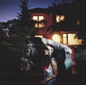 Natasha Khan Instagram - My debut record Fur and Gold is almost 20 years old, and she still holds such a special place in my heart… listening back through the whole album recently, side by side with producer @davidkosten brought a proud tear to my eye… no compromise, tons of space, shit midi sounds, tongue in cheek lyrics, thunder and lightning, girl group BV’s, heartbreak and magic… the record I had been waiting my whole life to make.

To mark 20 years, the record has been remastered by the award-winning Frank Arkwright at Abbey Road Studios and will be accompanied by a treasure trove of early demos from 2005-6, alongside BBC Live Lounge and Rob Da Bank sessions. The special anniversary edition will be released on 180g audiophile black vinyl and as an expanded double CD, with unseen photography from the era. It will be released on February 13th 2026! Pre-orders are open now.

For now, you can find the remastered album in its digital form wherever you listen to music 🐎

T-shirt design by @bonbiforest, based off her original design in 2006.