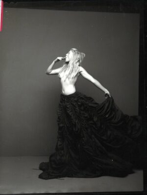 Peta Wilson Instagram - Costume Nationale dress and norma Kamali parachute skirt. After hours on a back set of LFN. Photographer Tony Notaberadino