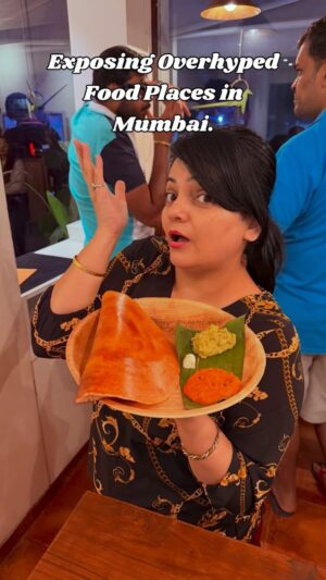 Priyanka Tiwari Instagram - Exposing Overhyped Food Places in Mumbai @benne.bombay 
.
I finally went to Benne – the super hyped Bangalore-style dosa café in Juhu (JVPD) and did the full experience from queue to first bite… and WOW.

First of all, be ready to wait. On busy days and weekends, there’s easily a 20–30 minute line before you even get in, and the queue literally snakes outside the café. 
No reservations, no shortcuts – everyone stands and waits their turn.

Once you enter, it’s not a regular sit-down restaurant at all.
It’s a darshini-style setup inspired by Bengaluru cafes –
	•	You don’t sit at tables here, you either stand and eat or grab a spot at the high counters/benches to park your plate.
	•	You order yourself at the digital screen – pick your dosa, idli, coffee, dessert, pay, and you get a bill number.
	•	Then you wait inside till your number flashes on the screen, collect your plate from the counter and dive in.

Here’s what I tried :

✨ Benne / Ghee Tatte Idli – soft, slightly thick idlis drenched in ghee/benne, with chutneys that actually have flavour and spice.
✨ Benne Masala Dosa – thick, super crispy edges, soft centre, that golden buttery crust and a generous dollop of white butter on top. Proper Bangalore-style benne dosa vibes.
✨ Filter Coffee – strong, aromatic and just sweet enough; pairs perfectly with all that butter and podi. 
✨ Bene Chocolate Fudge – this was my fun twist at the end: warm chocolate brownie   coffee ice cream   chocolate fudge sauce… basically a rich, coffee-chocolate dessert to close the meal.

The whole place is pure chaos in a good way – long queues, fast-moving orders, sizzling dosa plates coming out non-stop, people standing and eating, and that strong smell of butter   filter coffee everywhere.

📍 Benne – Heritage Bangalore Dosa, Juhu
Gulmohar Road, JVPD, Vile Parle (W), Mumbai
.
#food #foodie #fyp