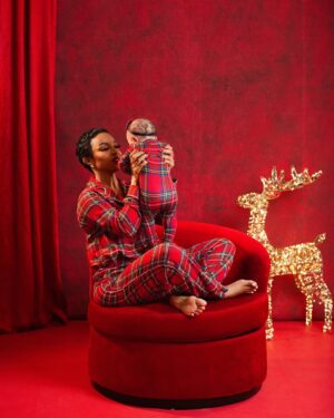 Toke Makinwa Instagram - Yaya’s 1st Christmas 
My first Christmas as a Mom 
We wore matching Pj’s too and daddy approves 😍😍😍😍.

Merry Christmas from my family to yours ❤️

📸 - @bangraphy