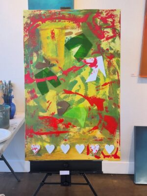Dawn McCoy Instagram - This collaborative painting was made during @desertopenstudios at @janssenartspace 

During three days six of us created this piece. We were all so different that I wondered how it would turn out. Look through all the pictures to see the transformation. It started out green and yellow. Then a black and white spritz. I added hearts and @tjanderson.studio added blocks of wood and acrylic. Just when it looked hopeless I added a wash of light pink. Then @arron_buttram_art came to the rescue and added structure and ideas. 

This painting will be on display this Friday at the opening 5-8pm. All proceeds will be donated to the @lovingwayfoundation that was founded by @iamdawnmccoy 🩵🩷

Other artists that participated in creating this piece were @studioroth.ps @tjanderson.studio and @mid_mod_facade 

If you’re in town, be sure to see the painting in person!

#pinkart #artheals #lovingwayfoundation #artdonation #collaboration