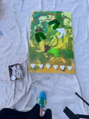 Dawn McCoy Instagram - This collaborative painting was made during @desertopenstudios at @janssenartspace 

During three days six of us created this piece. We were all so different that I wondered how it would turn out. Look through all the pictures to see the transformation. It started out green and yellow. Then a black and white spritz. I added hearts and @tjanderson.studio added blocks of wood and acrylic. Just when it looked hopeless I added a wash of light pink. Then @arron_buttram_art came to the rescue and added structure and ideas. 

This painting will be on display this Friday at the opening 5-8pm. All proceeds will be donated to the @lovingwayfoundation that was founded by @iamdawnmccoy 🩵🩷

Other artists that participated in creating this piece were @studioroth.ps @tjanderson.studio and @mid_mod_facade 

If you’re in town, be sure to see the painting in person!

#pinkart #artheals #lovingwayfoundation #artdonation #collaboration