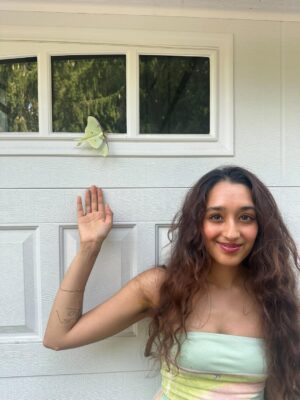 Raveena Aurora Instagram - MAMA CAME BACK TO GIVE US A SIGN😭🦋🦋 after I was searching for the rare luna moth to see in person for the last 3 years - she appeared resting on our garage door for hours -  the same day we brought moms ashes home. All the magical coincidences of me also wearing a Luna moth dress on this day, of Pluto (the song about coming back after death as a butterfly) being her favorite song and the last song of mine she asked me to sing to her before she passed, of the same butterfly being sprawled all over the album covers and merch and now tattooed on my body, and the fact that it’s  so rare to see the Luna moth in person because of its nocturnal nature … it’s all too perfect and magical 🩵 Im starting to feel my angel all around me , even thru the endless tears 😭😭😭😭😭😭