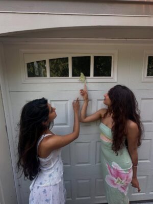 Raveena Aurora Instagram - MAMA CAME BACK TO GIVE US A SIGN😭🦋🦋 after I was searching for the rare luna moth to see in person for the last 3 years - she appeared resting on our garage door for hours -  the same day we brought moms ashes home. All the magical coincidences of me also wearing a Luna moth dress on this day, of Pluto (the song about coming back after death as a butterfly) being her favorite song and the last song of mine she asked me to sing to her before she passed, of the same butterfly being sprawled all over the album covers and merch and now tattooed on my body, and the fact that it’s  so rare to see the Luna moth in person because of its nocturnal nature … it’s all too perfect and magical 🩵 Im starting to feel my angel all around me , even thru the endless tears 😭😭😭😭😭😭