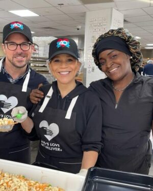 Rosie Perez Instagram - Okay. Hate the hair net by love that hat!! Volunteering at @godslovenyc today #WorldAidsDay2025! Such a loving and fun atmosphere here. Feels great. Especially on a tough day of Remembering so many loved ones who have gone too soon from this horrific disease. The volunteers at GLWD make the day so much easier. Please join us whenever you have a free moment to volunteer too. Just check their website. It’ll make you feel good inside as well. #UntilTheresACure ❤️❤️❤️