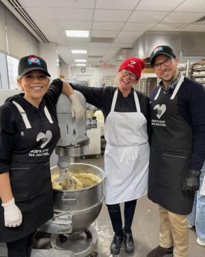 Rosie Perez Instagram - Okay. Hate the hair net by love that hat!! Volunteering at @godslovenyc today #WorldAidsDay2025! Such a loving and fun atmosphere here. Feels great. Especially on a tough day of Remembering so many loved ones who have gone too soon from this horrific disease. The volunteers at GLWD make the day so much easier. Please join us whenever you have a free moment to volunteer too. Just check their website. It’ll make you feel good inside as well. #UntilTheresACure ❤️❤️❤️