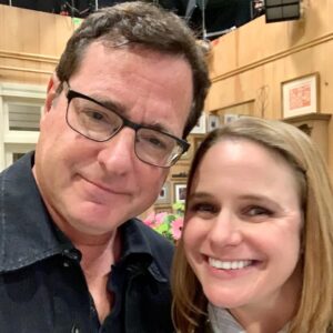 Andrea Barber Instagram - Every year it seems I write about grief on January 9th. 

It feels like I’m slowly losing the most important people in my life - an inevitable part of aging, I suppose. Today marks five years since I lost my mom, and four since we lost Bob. Last year I lost my soul dog, Holly, which only deepens the grief I already feel. 

The sharpness of grief does soften with time. I don’t feel suffocated by it the way I once did. But it never leaves. It’s woven into me now, a part of my DNA, a part of who I am, even on the days when it doesn’t announce itself loudly.

And then there are anniversaries like today, when the scab lifts for a moment and reflection rushes in.

I can’t believe it’s been five years since I last spoke with my mom. I find myself mentally cataloging everything that’s happened since she left, and I’m often stunned by how much life I’ve lived without her. 

I’m still comforted by her signs. The day I said goodbye to Holly, I sat in the sunshine with her asleep in my lap during the final hour of her life. And then, as if on cue, a hummingbird flew in and hovered directly in front of my face for what felt like thirty seconds before flying off. It was Mom. She showed up exactly when I needed her most. These signs are a healing balm for my tender soul. 

It’s strange to live in a world where Bob’s voice exists only in memory. I never imagined him being this quiet, even in death. I hope he knows how often we talk about him here. How deeply he is loved. Every single day.

One of the unexpected gifts of doing a Full House rewatch podcast has been rediscovering Bob’s brilliance. It’s the micro-moments: the glint in his eye as he tries to avoid breaking in front of Dave, the lines that I just know he ad-libbed. The Danny Tanner heart scenes that still bring a tear to my eye. What a gift it’s been to watch him shine nearly four decades later. 

I don’t know why the best ones leave us so early. Maybe they were simply too good for this world. Maybe they’re needed elsewhere to keep spreading their love and joy.

Grief is the price of deep love. And I carry it every day with gratitude for the ones I miss. 🤍🕊️