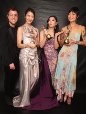 Arden Cho Instagram - What a night!! Thank you so much @hollywoodcreativealliance for The Best Voiceover Award for Rumi 💜 KPDH also won Best Animation and Best Song! 3 for 3! So much love all night and felt like a Queen in this special custom gown @waltercollection created for me (inspired by Rumi) SO many people mentioned the beading was like Rumi’s patterns… thank you Walter, you’re the best! So good to see Dylan and thank you @lisa_hiser for capturing that cute moment haha 🤣 no tea 🍵 just catching up!! Congrats to both of us! What a journey it’s been for us all. Swipe to the end for a bunch more snaps and of course a puppy. Don’t miss the puppy!!!