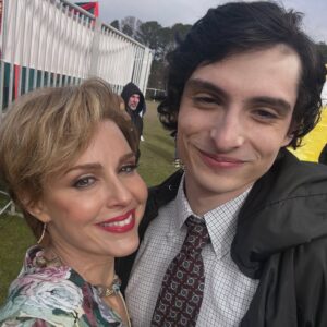 Cara Buono Instagram - Hawkins Graduation. We all got haircuts. Karen opted for something a nod to Princess Diana, 1989, a new chapter. And shoulder pads!

This carousel is a little of everything: the end of a story, the beginning of goodbye, and the magic trick of turning brushes, glue, and patience into something that looks painful but feels like love.

Endless gratitude to our hair/makeup/sfx artists who literally scarred me with care and made sure Karen Wheeler went out properly lived-in. 

@kruegermekash 
@mikemekash 
@bloodorphan 
@sarahhindsgaul 
@katsuhre 
@jessiegambi 
@amyparris

@strangerthingstv 
@netflix 

#strangerthings #graduation #setlife #scars