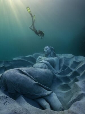 Kiko Mizuhara Instagram - I feel truly honored to have been part of this very special project — the creation of Ocean Gaia, an underwater sculpture by Jason Decaires Taylor @jasondecairestaylor , now resting in the beautiful ocean of my beloved Tokunoshima 🌊🤍

This project has been in the making for nearly two years. So many hearts, hands, and hopes came together to bring this vision to life.

The sculpture lies gently on the seabed, just a short distance from the shore, at a depth of 5 meters.
It was created in the image of my calm expression, standing 2 meters tall, 5.5 meters wide, and weighing 45 tons — the very first large-scale underwater sculpture ever installed in Japan.

As part of the coral reef, the piece features openings that allow fish and other marine life to move freely in and out, making it not only a work of art but also a new home for the ocean’s ecosystem.
Its soft, swirling form was inspired by the intricate sand patterns created by Amami Hoshizara puffer fish🐡, as well as the gentle curves of the island’s mountain range.

Tokunoshima is known for its longevity, vibrant birth rate, and deep connection to nature.
The mountain ridge at the island’s center resembles the silhouette of a pregnant woman — a symbol of life itself. Ocean Gaia was born from the Gaia myth, embodying the bond between people and the sea, and celebrating the cycle of life 🌿

As more young people leave the island for the cities, my hope is that this piece will spark a renewed connection to the ocean, nature, and culture for the next generation. And maybe, it will inspire more people to fall in love with the sea and look more closely at the natural world around us ❤️

Being underwater and seeing Ocean Gaia for the first time as it began to breathe with the ocean was unforgettable — a truly special birthday memory I’ll carry with me forever.

I can’t wait to watch how this sculpture slowly becomes part of the reef, a home for coral and marine life, and how its story will be woven into the ocean over time 🌊✨

Thank you from the bottom of my heart to everyone in Tokunoshima.