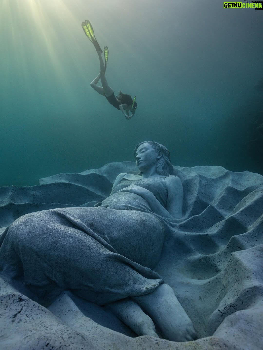 Kiko Mizuhara - 327.2K Likes - I feel truly honored to have been part of this very special project — the creation of Ocean Gaia, an underwater sculpture by Jason Decaires Taylor @jasondecairestaylor , now resting in the beautiful ocean of my beloved Tokunoshima 🌊🤍

This project has been in the making for nearly two years. So many hearts, hands, and hopes came together to bring this vision to life.

The sculpture lies gently on the seabed, just a short distance from the shore, at a depth of 5 meters.
It was created in the image of my calm expression, standing 2 meters tall, 5.5 meters wide, and weighing 45 tons — the very first large-scale underwater sculpture ever installed in Japan.

As part of the coral reef, the piece features openings that allow fish and other marine life to move freely in and out, making it not only a work of art but also a new home for the ocean’s ecosystem.
Its soft, swirling form was inspired by the intricate sand patterns created by Amami Hoshizara puffer fish🐡, as well as the gentle curves of the island’s mountain range.

Tokunoshima is known for its longevity, vibrant birth rate, and deep connection to nature.
The mountain ridge at the island’s center resembles the silhouette of a pregnant woman — a symbol of life itself. Ocean Gaia was born from the Gaia myth, embodying the bond between people and the sea, and celebrating the cycle of life 🌿

As more young people leave the island for the cities, my hope is that this piece will spark a renewed connection to the ocean, nature, and culture for the next generation. And maybe, it will inspire more people to fall in love with the sea and look more closely at the natural world around us ❤️

Being underwater and seeing Ocean Gaia for the first time as it began to breathe with the ocean was unforgettable — a truly special birthday memory I’ll carry with me forever.

I can’t wait to watch how this sculpture slowly becomes part of the reef, a home for coral and marine life, and how its story will be woven into the ocean over time 🌊✨

Thank you from the bottom of my heart to everyone in Tokunoshima.