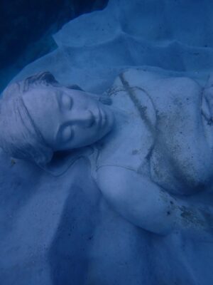 Kiko Mizuhara Instagram - I feel truly honored to have been part of this very special project — the creation of Ocean Gaia, an underwater sculpture by Jason Decaires Taylor @jasondecairestaylor , now resting in the beautiful ocean of my beloved Tokunoshima 🌊🤍

This project has been in the making for nearly two years. So many hearts, hands, and hopes came together to bring this vision to life.

The sculpture lies gently on the seabed, just a short distance from the shore, at a depth of 5 meters.
It was created in the image of my calm expression, standing 2 meters tall, 5.5 meters wide, and weighing 45 tons — the very first large-scale underwater sculpture ever installed in Japan.

As part of the coral reef, the piece features openings that allow fish and other marine life to move freely in and out, making it not only a work of art but also a new home for the ocean’s ecosystem.
Its soft, swirling form was inspired by the intricate sand patterns created by Amami Hoshizara puffer fish🐡, as well as the gentle curves of the island’s mountain range.

Tokunoshima is known for its longevity, vibrant birth rate, and deep connection to nature.
The mountain ridge at the island’s center resembles the silhouette of a pregnant woman — a symbol of life itself. Ocean Gaia was born from the Gaia myth, embodying the bond between people and the sea, and celebrating the cycle of life 🌿

As more young people leave the island for the cities, my hope is that this piece will spark a renewed connection to the ocean, nature, and culture for the next generation. And maybe, it will inspire more people to fall in love with the sea and look more closely at the natural world around us ❤️

Being underwater and seeing Ocean Gaia for the first time as it began to breathe with the ocean was unforgettable — a truly special birthday memory I’ll carry with me forever.

I can’t wait to watch how this sculpture slowly becomes part of the reef, a home for coral and marine life, and how its story will be woven into the ocean over time 🌊✨

Thank you from the bottom of my heart to everyone in Tokunoshima.