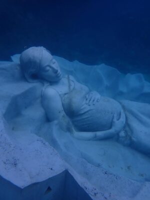 Kiko Mizuhara Instagram - I feel truly honored to have been part of this very special project — the creation of Ocean Gaia, an underwater sculpture by Jason Decaires Taylor @jasondecairestaylor , now resting in the beautiful ocean of my beloved Tokunoshima 🌊🤍

This project has been in the making for nearly two years. So many hearts, hands, and hopes came together to bring this vision to life.

The sculpture lies gently on the seabed, just a short distance from the shore, at a depth of 5 meters.
It was created in the image of my calm expression, standing 2 meters tall, 5.5 meters wide, and weighing 45 tons — the very first large-scale underwater sculpture ever installed in Japan.

As part of the coral reef, the piece features openings that allow fish and other marine life to move freely in and out, making it not only a work of art but also a new home for the ocean’s ecosystem.
Its soft, swirling form was inspired by the intricate sand patterns created by Amami Hoshizara puffer fish🐡, as well as the gentle curves of the island’s mountain range.

Tokunoshima is known for its longevity, vibrant birth rate, and deep connection to nature.
The mountain ridge at the island’s center resembles the silhouette of a pregnant woman — a symbol of life itself. Ocean Gaia was born from the Gaia myth, embodying the bond between people and the sea, and celebrating the cycle of life 🌿

As more young people leave the island for the cities, my hope is that this piece will spark a renewed connection to the ocean, nature, and culture for the next generation. And maybe, it will inspire more people to fall in love with the sea and look more closely at the natural world around us ❤️

Being underwater and seeing Ocean Gaia for the first time as it began to breathe with the ocean was unforgettable — a truly special birthday memory I’ll carry with me forever.

I can’t wait to watch how this sculpture slowly becomes part of the reef, a home for coral and marine life, and how its story will be woven into the ocean over time 🌊✨

Thank you from the bottom of my heart to everyone in Tokunoshima.