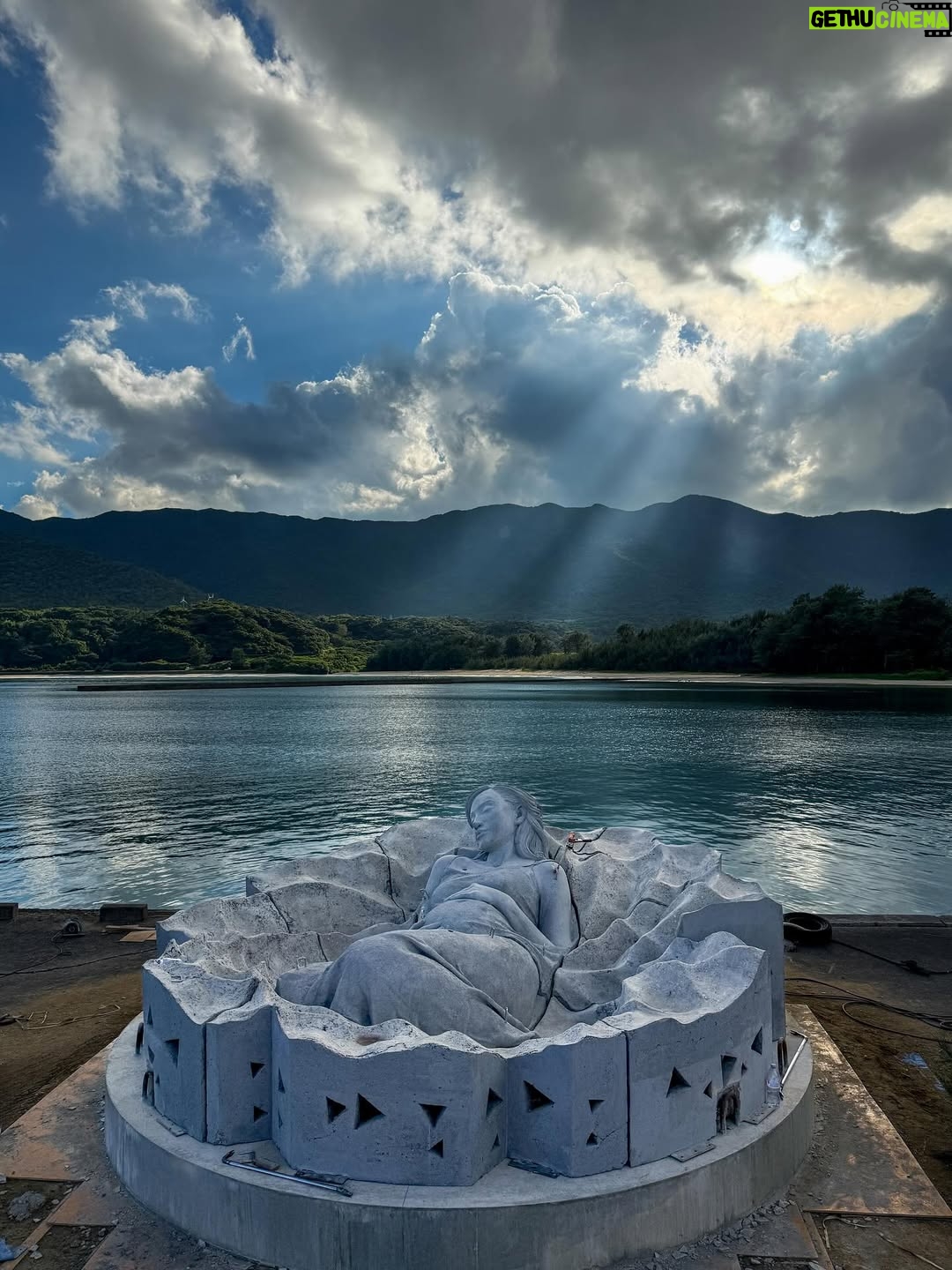 Kiko Mizuhara - 327.2K Likes - I feel truly honored to have been part of this very special project — the creation of Ocean Gaia, an underwater sculpture by Jason Decaires Taylor @jasondecairestaylor , now resting in the beautiful ocean of my beloved Tokunoshima 🌊🤍

This project has been in the making for nearly two years. So many hearts, hands, and hopes came together to bring this vision to life.

The sculpture lies gently on the seabed, just a short distance from the shore, at a depth of 5 meters.
It was created in the image of my calm expression, standing 2 meters tall, 5.5 meters wide, and weighing 45 tons — the very first large-scale underwater sculpture ever installed in Japan.

As part of the coral reef, the piece features openings that allow fish and other marine life to move freely in and out, making it not only a work of art but also a new home for the ocean’s ecosystem.
Its soft, swirling form was inspired by the intricate sand patterns created by Amami Hoshizara puffer fish🐡, as well as the gentle curves of the island’s mountain range.

Tokunoshima is known for its longevity, vibrant birth rate, and deep connection to nature.
The mountain ridge at the island’s center resembles the silhouette of a pregnant woman — a symbol of life itself. Ocean Gaia was born from the Gaia myth, embodying the bond between people and the sea, and celebrating the cycle of life 🌿

As more young people leave the island for the cities, my hope is that this piece will spark a renewed connection to the ocean, nature, and culture for the next generation. And maybe, it will inspire more people to fall in love with the sea and look more closely at the natural world around us ❤️

Being underwater and seeing Ocean Gaia for the first time as it began to breathe with the ocean was unforgettable — a truly special birthday memory I’ll carry with me forever.

I can’t wait to watch how this sculpture slowly becomes part of the reef, a home for coral and marine life, and how its story will be woven into the ocean over time 🌊✨

Thank you from the bottom of my heart to everyone in Tokunoshima.