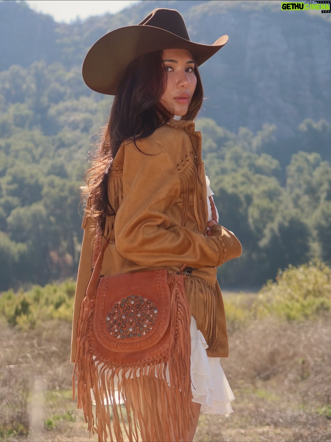 Linzy Luu - 5.9K Likes - Cowgirl at heart 🤎 Boots that wander and a fringe bag that keeps up with me — @myrabag ໋𐚁 ⋆ ℧