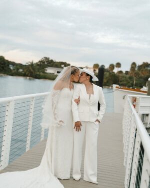 Marta Instagram - Love is Love — the wedding day of @martavsilva10 & @carrie__lawrence surrounded by their favorite people ✨
⁣
Planner: @jcloss_events⁣
Photography: @kirnosphotography⁣
Venue: @pelicanclub_jupiter⁣
Florist: @nelumbo.us⁣
Marta’s Suit: @estudiocarlagaspar⁣
Shoes: @prada ⁣
Hat:@graciellastarling⁣
Carrie’s dress: @angelriverabride⁣
Video: @h2weddingfilms⁣
Hair & Make-up: @bronzeglowbeauty⁣
Rentals: @bossaeventrentals @allurepartyrentals⁣
Catering: @pelicanclub_jupiter⁣
Cake: @sweet_tiers_ ⁣
DJ: @djfabioneto⁣
Band: @electro-samba⁣
Photobooth: @thegalaphotobooth ⁣
Transportation: @mollystrolleyswpb