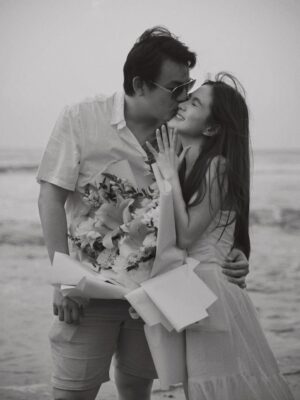 Shanice Margaretha Lie Instagram - The Easiest Yes Ever ˖⁺‧₊˚♡˚₊‧⁺˖

-

It was just an ordinary day, or so I thought, at the pool and favorite place, the beach. The waves were singing their usual song, the sun spilling gold over the water, and the wind carrying that salty scent I love so much. I was barefoot, laughing at something silly he said, when suddenly he stopped walking. He looked at me with that soft, almost nervous smile and before I could ask what was wrong, he was already down on one knee. 
My heart didn’t race in confusion. It didn’t hesitate. It just… knew.
He held out the ring, his voice steady but eyes glassy with emotion, and asked me to marry him.
And I swear, it was the easiest, most natural “Yes” I have ever said in my life ⋆｡‧˚ʚ♡ɞ˚‧｡⋆
