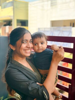 Shrinidhi Padmanaban Instagram - Everyone else is cute… but have you seen my annan magan? And his stages of the most wholesome smile🥹❤️ last picture has my whole heart 🧿