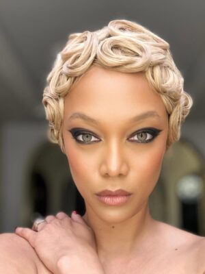 Tyra Banks Instagram - Golden TyTy 
All swirled up 💫 
Bathroom mirror magazine - ha!